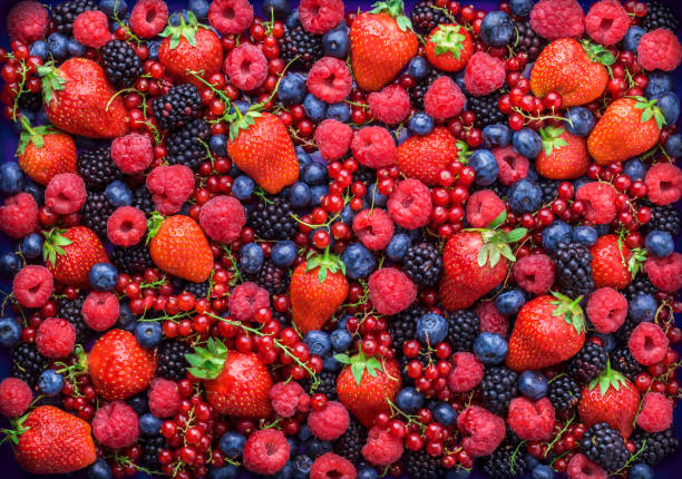 Berries overhead closeup assorted mix in studio on dark background Berries overhead closeup colorful assorted mix of strawbwerry, blueberry, raspberry, blackberry, red curant in studio on dark background antioxidant stock pictures, royalty-free photos & images