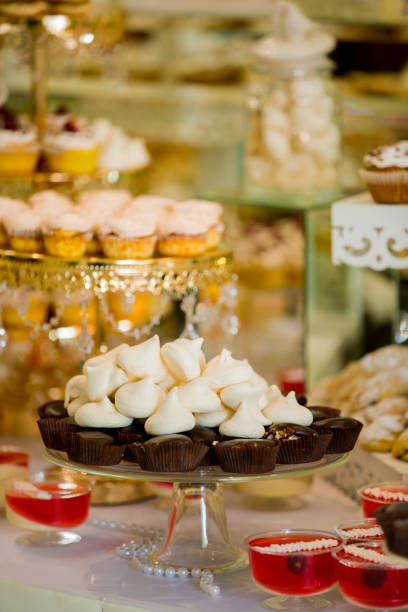 istock Table with sweets prepared for party. Candy bar. Delicious sweet buffet with cupcakes. Wedding Candy Bar. 841662872