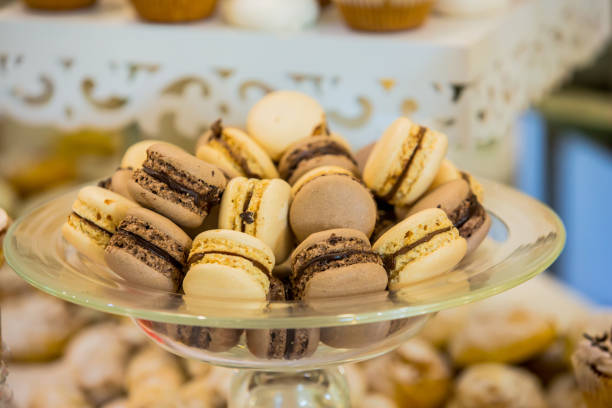 istock Delicious macaroons close-up. Delicious sweet buffet with cupcakes. A sweet festive buffet with cupcakes and other desserts. Sweet table 841663214