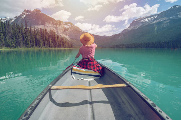 istock Emerald lake, Canada, Woman paddling canoe 841673332