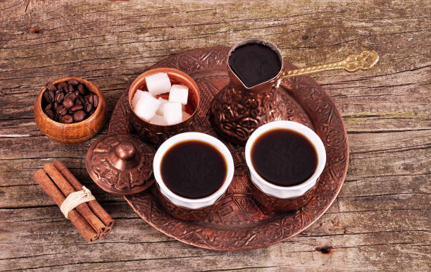 istock Coffee in copper coasters with accessories for coffee-drinking on old wooden background 841687282