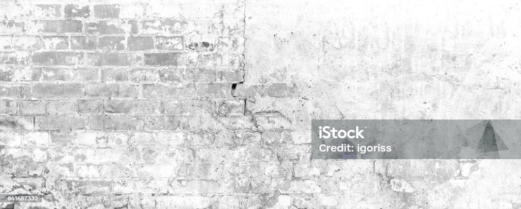 white wall Background. Old Vintage Brick Wall With Crashed White Plaster Texture Background. White Retro Wallpaper. Graffiti Brickwal. Brick Stock Photo