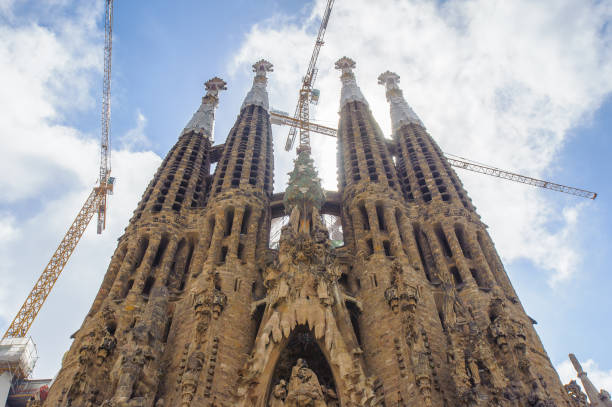 BARCELONA, SPAIN - JUN 23, 2014: Basilica and Expiatory Church of the Holy Family, is a Roman Catholic church in Barcelona, Spain, designed by Antoni Gaudi. UNESCO World Heritage Site