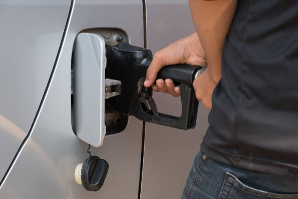istock Hand refilling the car with fuel at gas station 841712314