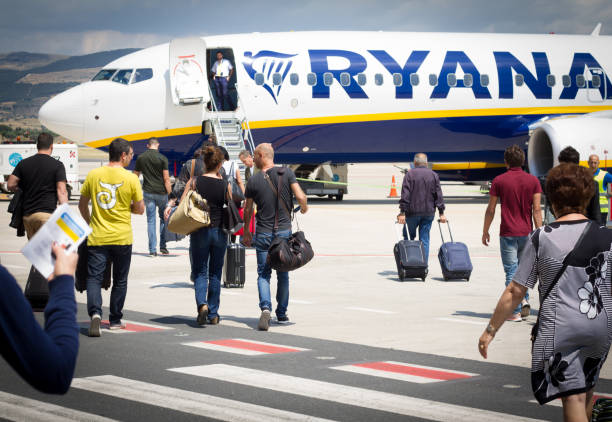 Comiso, Sicily, Italy: Passengers Boarding Ryanair on Tarmac stock photo