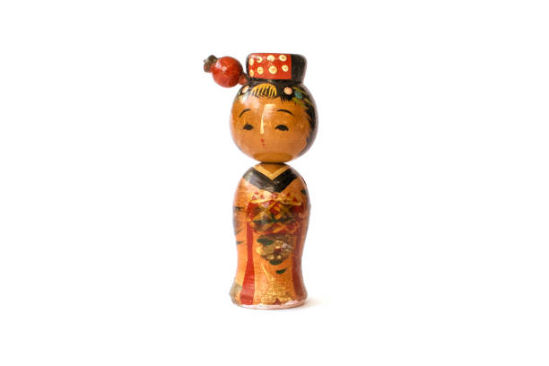 istock Varnished wood kokeshi doll isolated on white background. 841738976