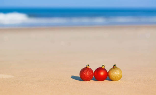 istock Christmas ornaments on a tropical beach 841742022