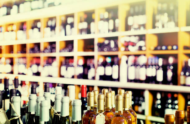 istock View on supermarket shelves with wine bottles 841746392