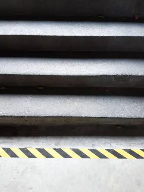 Photo of concrete staircase with warning line