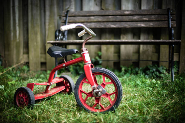 Old Red Kids Bike on The Grass