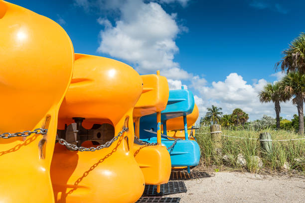 Pedal boats Stack of pedal boats at Miami Beach waiting for new customers. beautiful multi colored tranquil scene enjoyment stock pictures, royalty-free photos & images