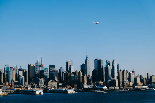 istock Manhattan seen from New Jersey and helicopter 841765236