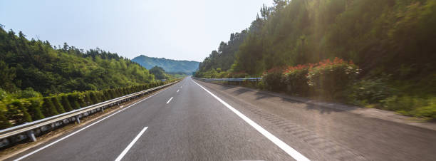 istock highway in motion blur under sunny day 841765690