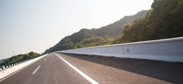 istock highway in motion blur under sunny day 841765984