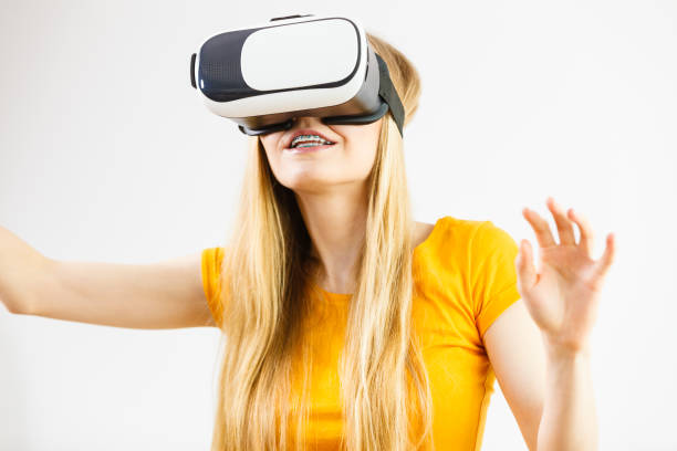 istock Girl wearing virtual reality goggles. 841773410