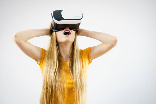 istock Girl wearing virtual reality goggles. 841780432