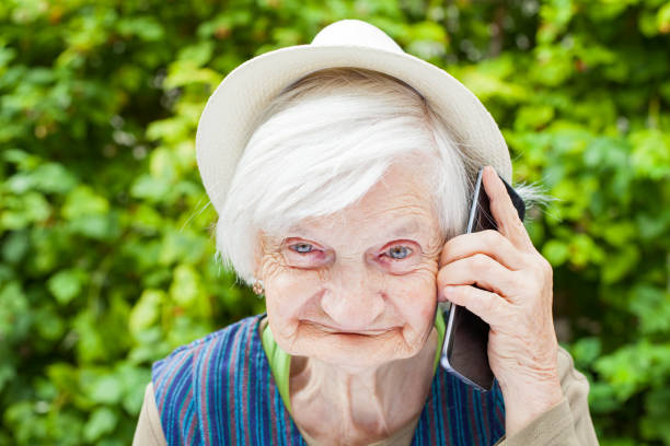 istock Happy smiling grandmother talking on mobile phone 841780646