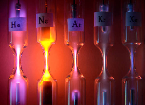 Geissler Tubes Tubes with inert gases excited with high voltage. From left to right: Helium, Neon, Argon, Krypton and Xenon. Each tube emits a different color and intensity. argon stock pictures, royalty-free photos & images