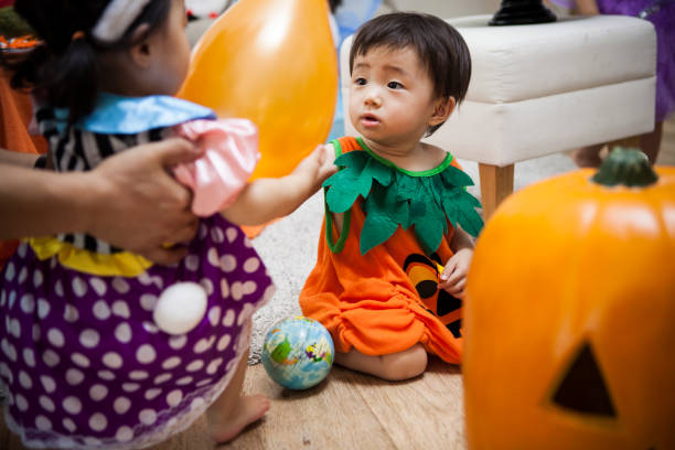 istock The baby enjoys a Halloween party. 841791396