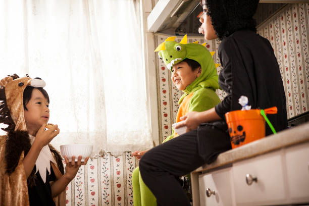 istock Children sitting on the shelf and eating sweets. 841795686