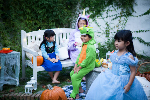 istock Children wearing costumes and playing outside. 841795714