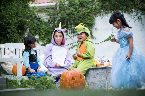 istock Children wearing costumes and playing outside. 841796100