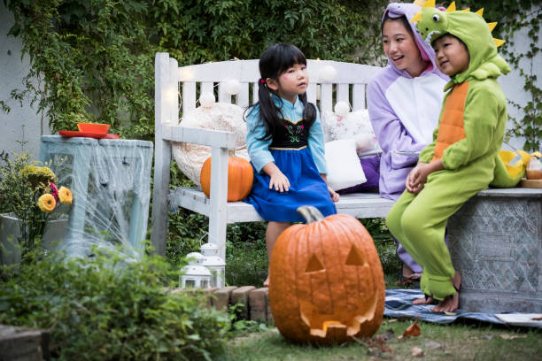 istock Children wearing costumes and playing outside. 841796134
