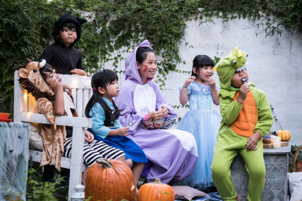 istock Children wearing costumes and playing outside. 841796168