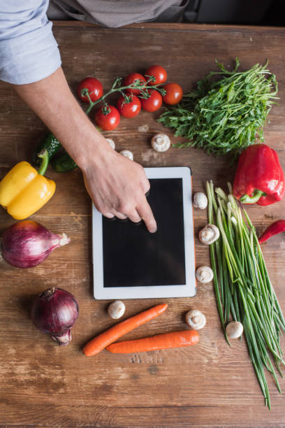 istock top view of young man cooking with tablet 841799964