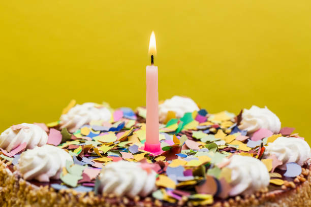 istock colorful birthday cake with candles 841805988