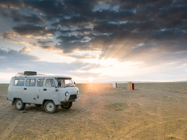 istock Sunset over Gobi Desert in Mongolia with land vehicle 841806902