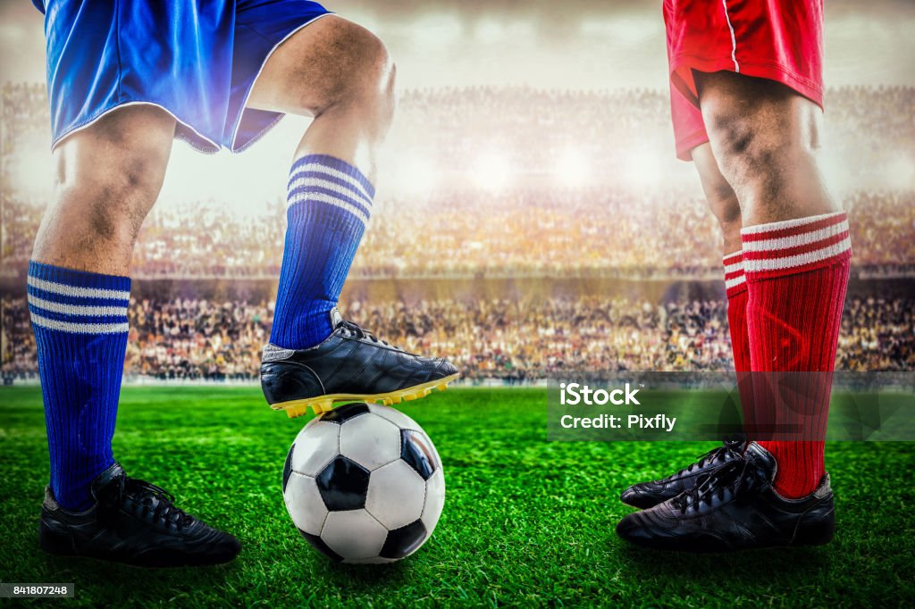 red team versus blue team in the stadium of soccer football Soccer Competition Stock Photo