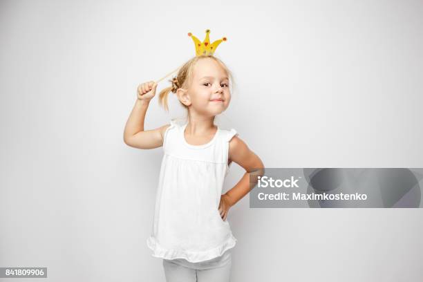 Beautiful Little Girl With Paper Crown Posing On White Backgroun Stock Photo - Download Image Now