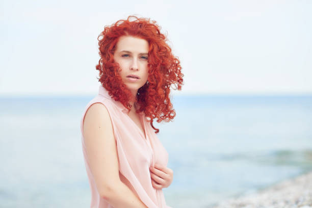 istock carefree woman on the  beach 841809936