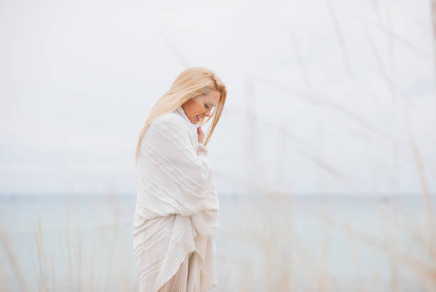 istock Young Woman Relaxing on Beach 841810264