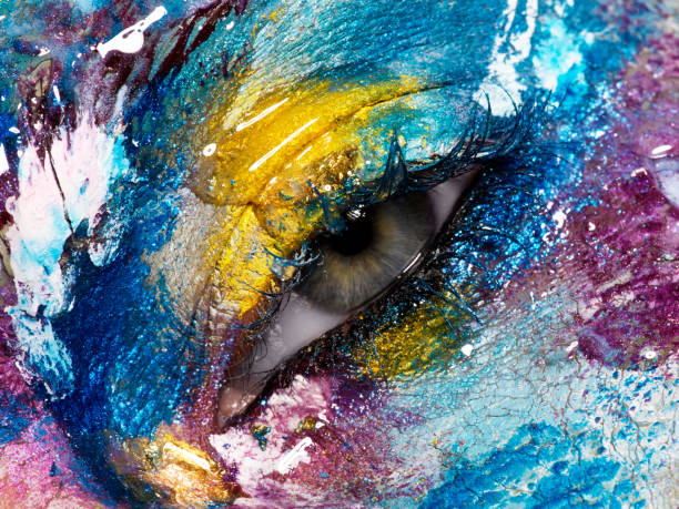 istock Beauty, cosmetics and makeup. Magic eyes look with bright creative make-up. Macro shot of beautiful woman's face with perfect art make up. Closeup of female eye. Body art 841815406