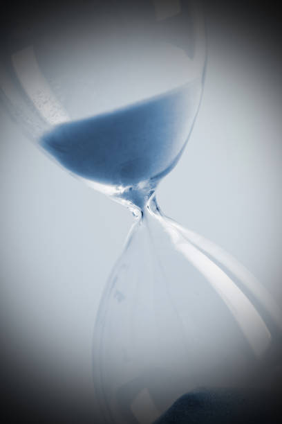 istock Close up of hourglass blue toned 841825168