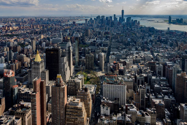 Cityscape of New York City Skyscrapers leading towards lower Manhattan, New York City. new york life building stock pictures, royalty-free photos & images