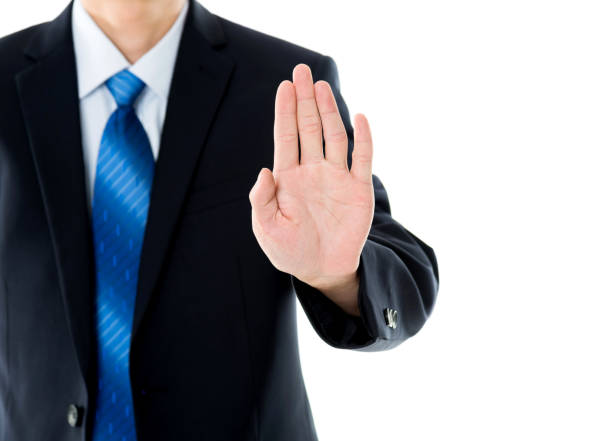 istock Businessman show STOP against white background 841826010