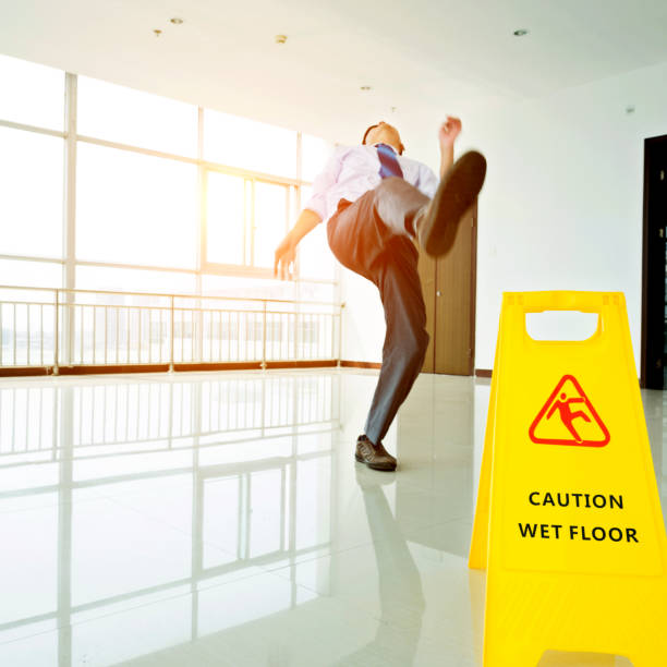 istock Businessman slipping on wet floor 841826042