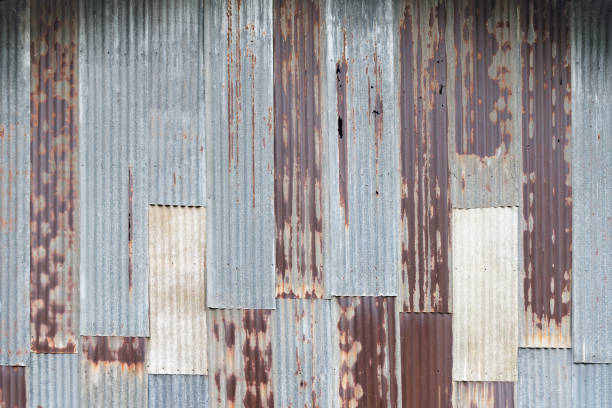istock Old rusty corrugated tin zinc metal wall in vintage tone. 841829578