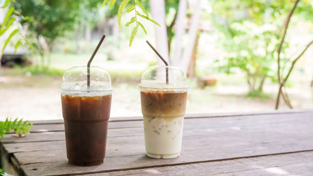 istock iced latte and americano coffee on a wooden table. 841832924