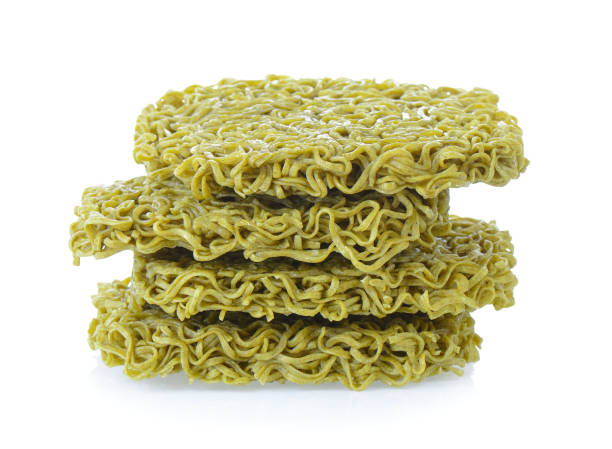 istock Dried organic green noodles on white background 841833354