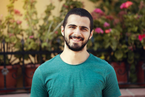 istock Portrait of smiling young man 841835680