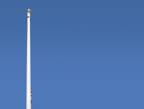 White mast of single flag and without flag with copy space