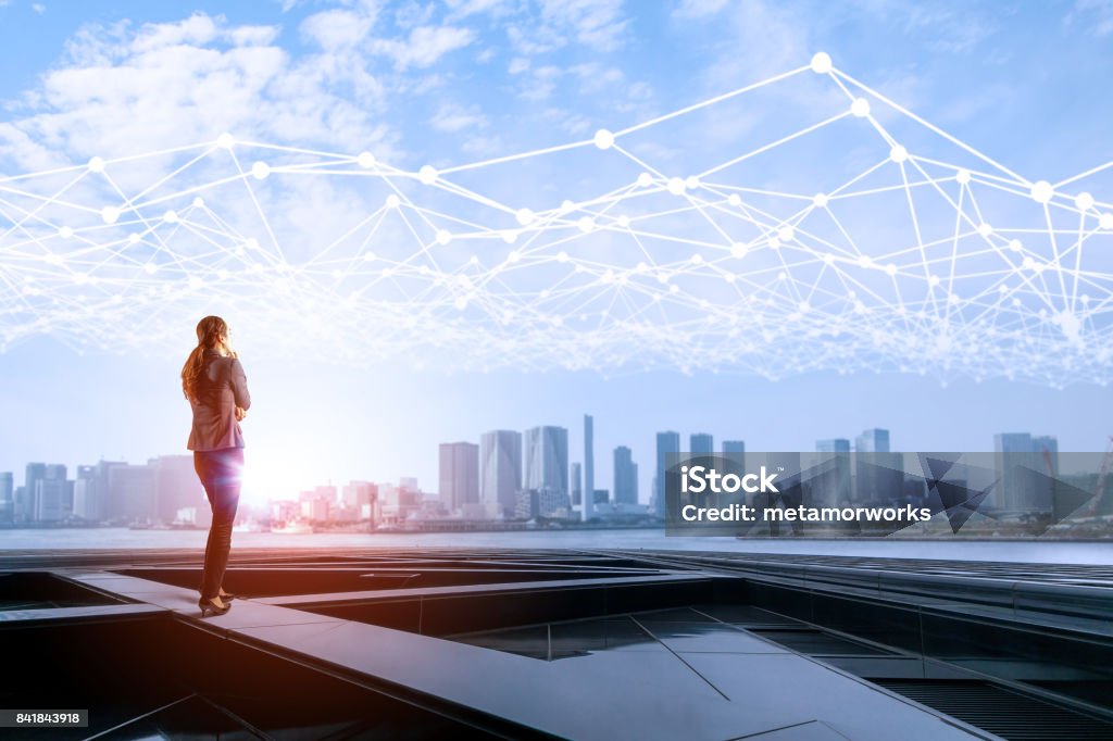 young business woman and mesh communication network concept. IoT(Internet of Things). ICT(Information Communication Network). Smart city. abstract mixed media. City Stock Photo