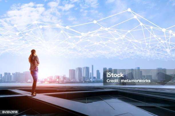 Young Business Woman And Mesh Communication Network Concept Iot Smart City Abstract Mixed Media Stock Photo - Download Image Now
