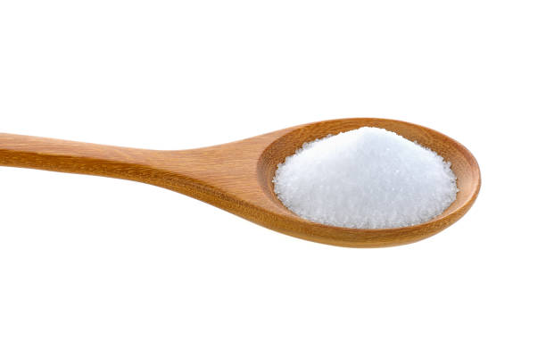 istock Salt in wooden spoon on white background 841846850