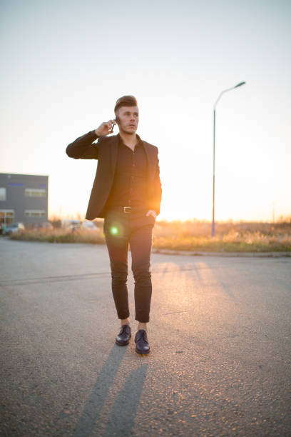 istock Attractive young businessman talking on the phone 841847384