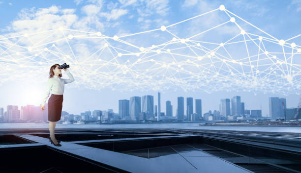 istock young business woman looking through field glasses and mesh communication network concept. IoT(Internet of Things). ICT(Information Communication Network). Smart city. network monitoring. 841847864